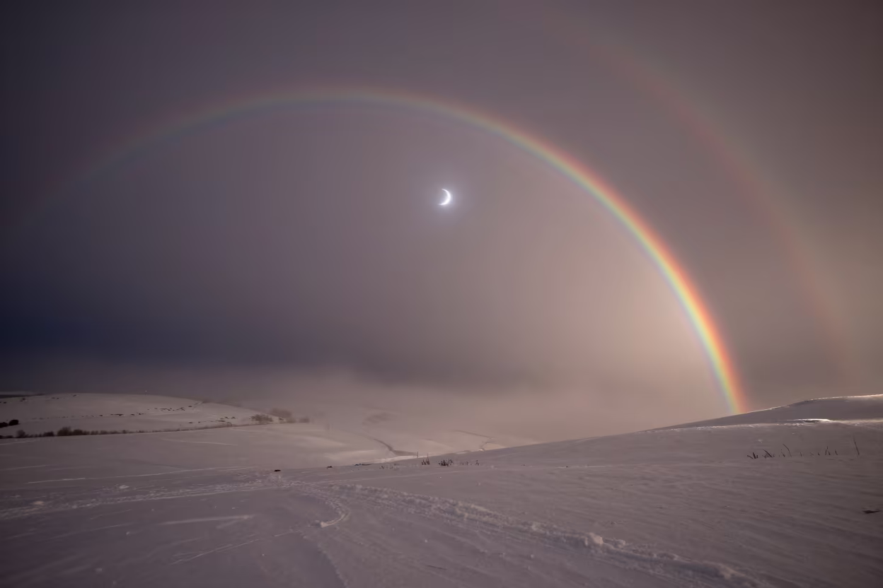 Double Lunar Rainbow Over Snowfields in beneath a hard winter sky over snowfields near Doncaster