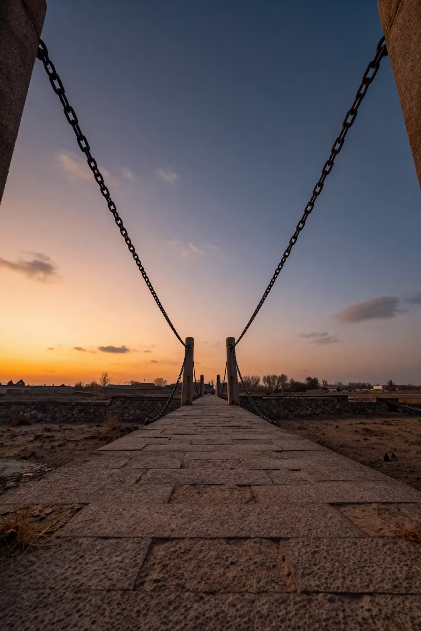 Drawbridge Chain at Sunset Over Moat in beneath a bridge span in Chaman