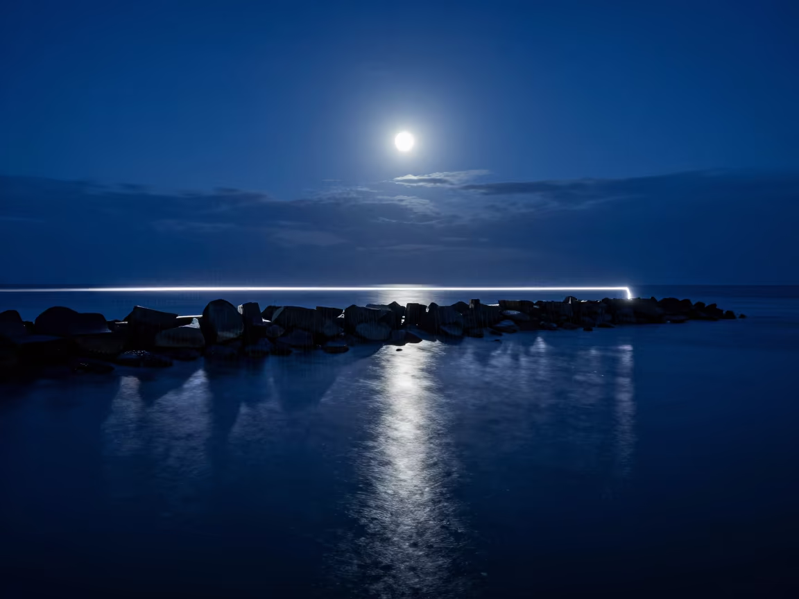 Drone Light Trail Over Moonlit Reef Breakwater in from a moonlit breakwater in the Great Barrier Reef