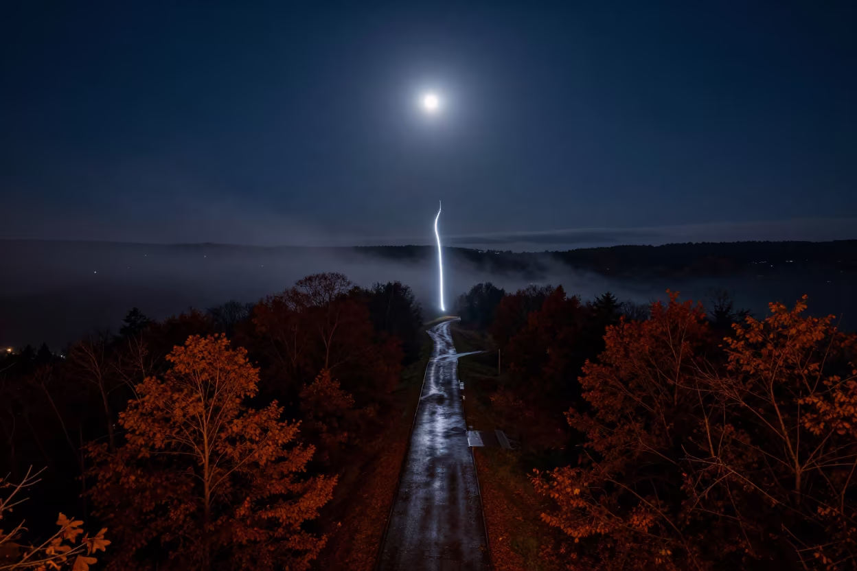 Drone Light Trails Over Georgia Autumn Night Sky in beneath a moon-washed horizon in Georgia