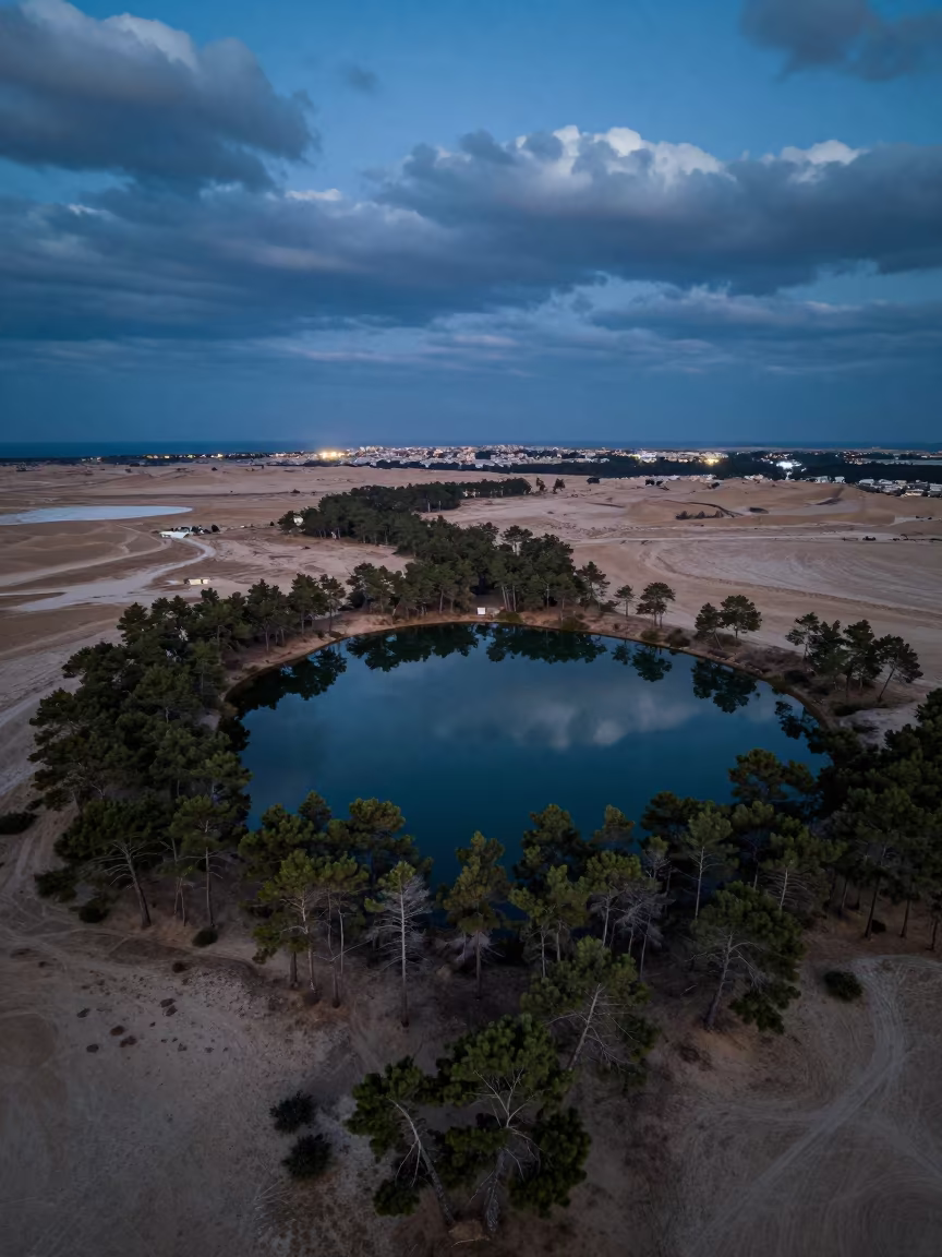 Drone view of forest lake near Jeddah at twilight in above dune fields and dry wadis near Jeddah