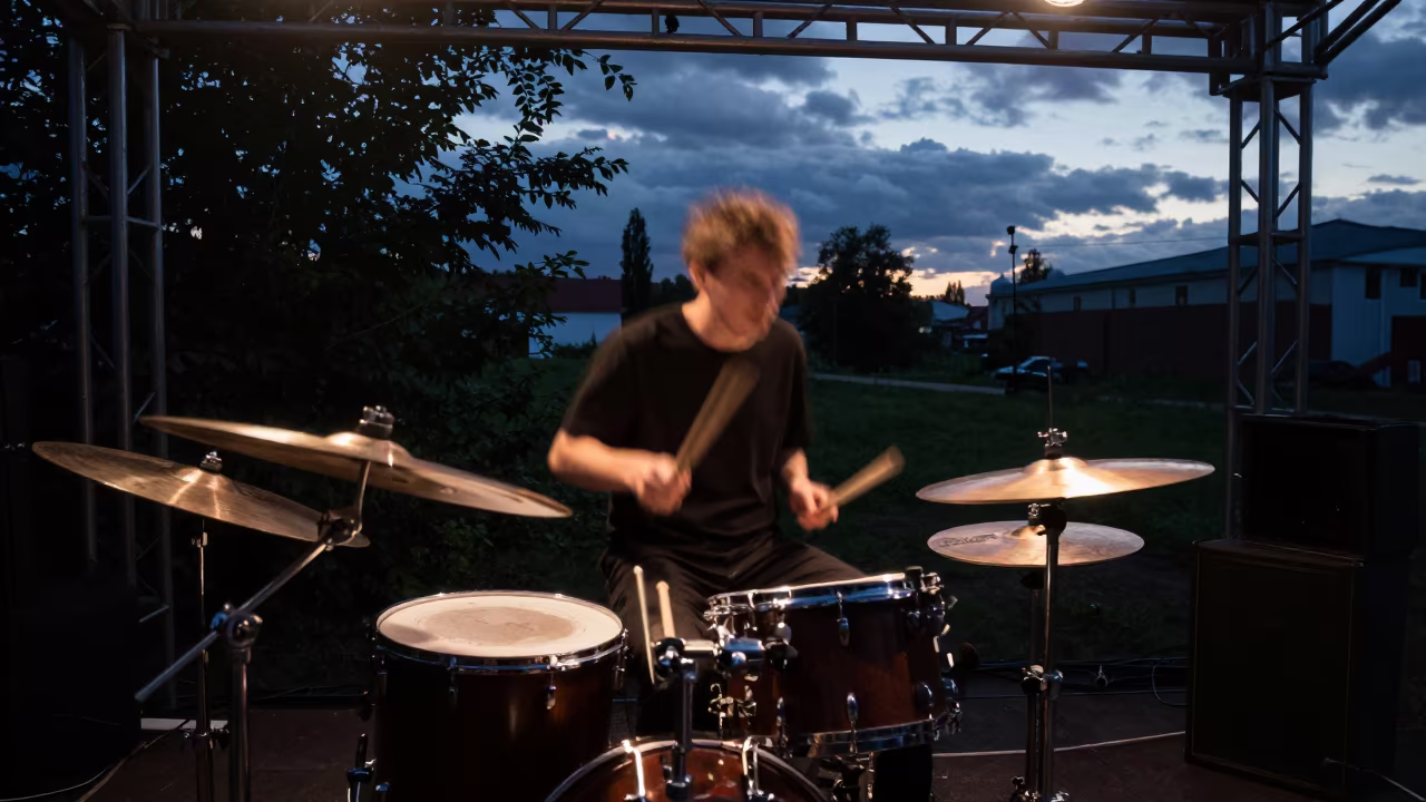 Drummer Sticks Motion Blur Concert Stage in on a dimly lit stage in Irkutsk