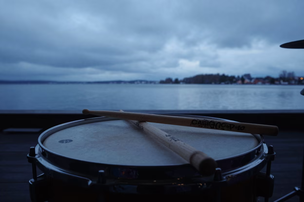 Drummer Sticks on Snare Before Evening Set in on a dimly lit stage in Odense