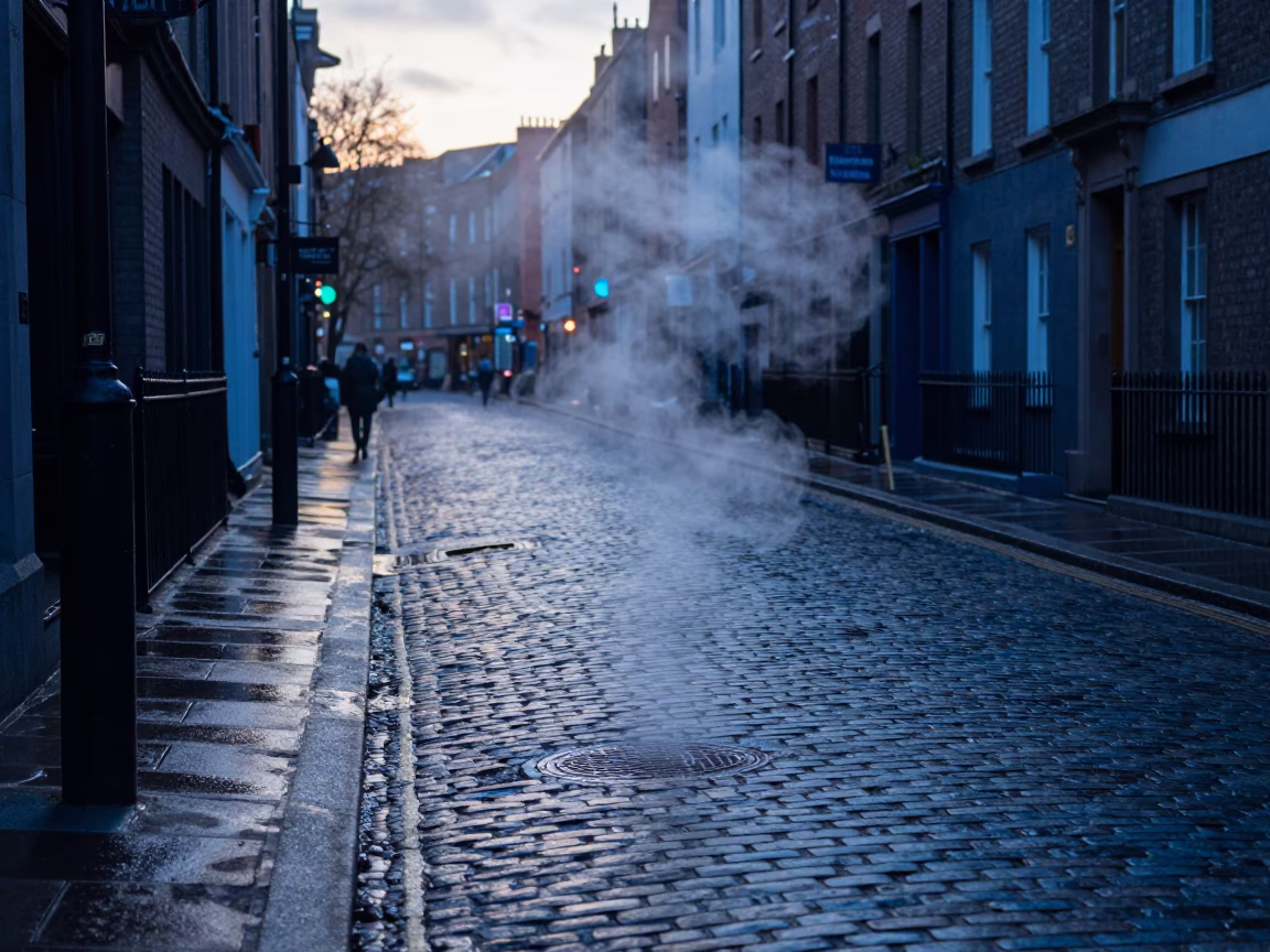 Dublin Dawn Street Scene with Steam and Wet Cobblestones in in Dublin, Ireland