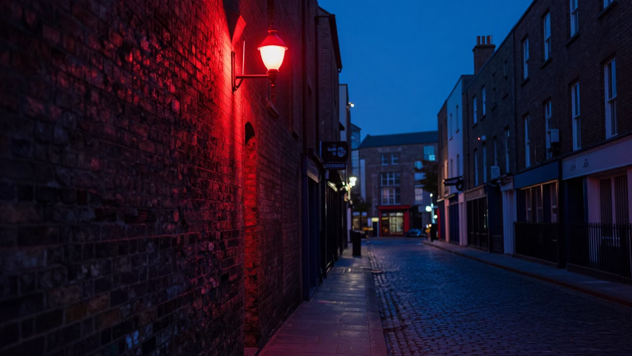 Dublin indigo twilight street scene with red night lights and colorful glass bottles in in Dublin, Ireland