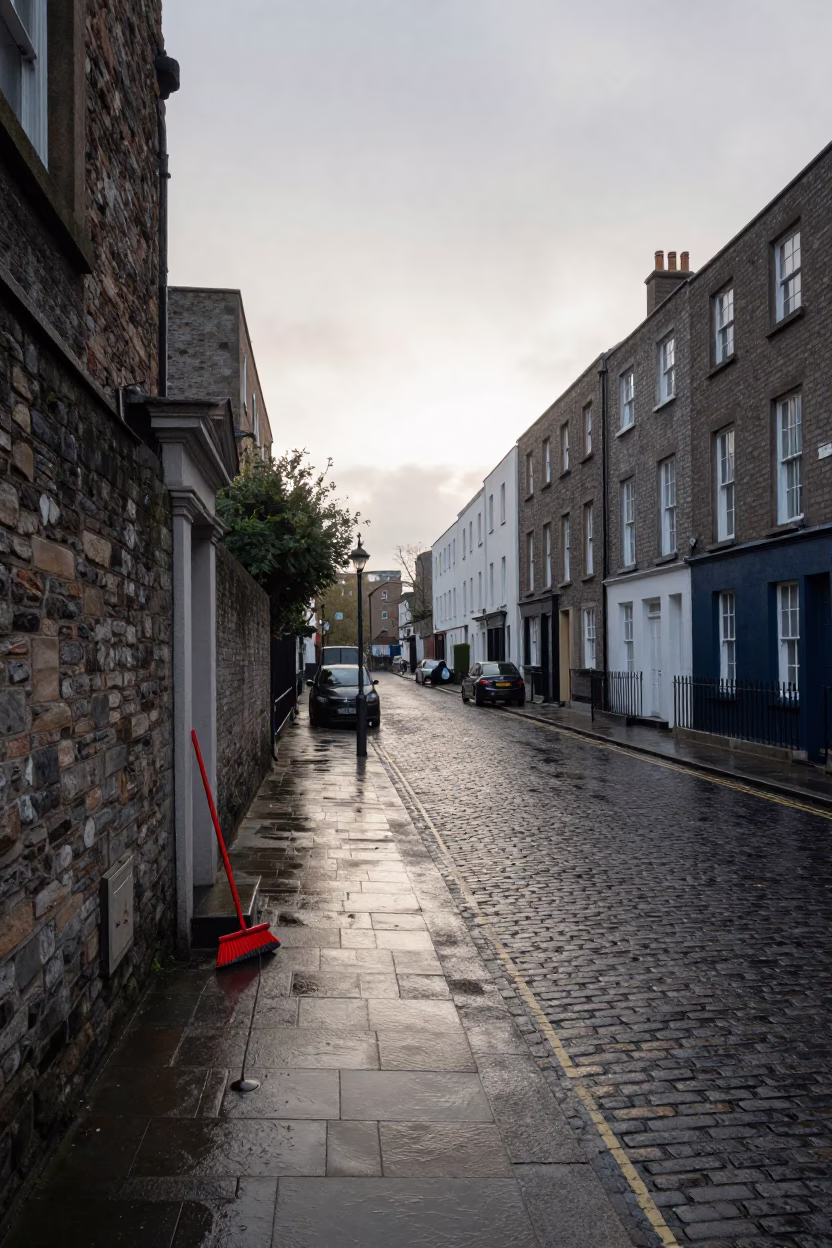 Dublin Ireland First Light Street Scene with Broom and Wet Cobblestones in in Dublin, Ireland