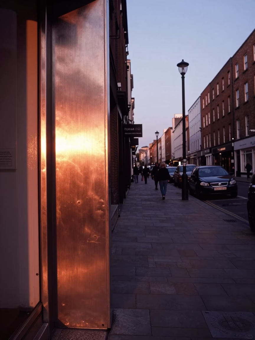 Dublin Street Corner Before Dusk with Brushed Steel Doorframe and Copper Light in in Dublin, Ireland