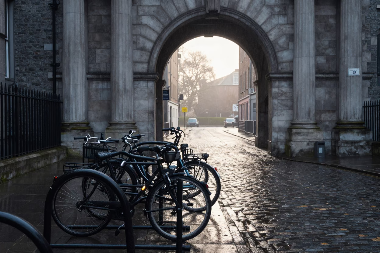 Dublin University Archway Framing Wet Bicycle Rack in Late Morning Light in in Dublin, Ireland