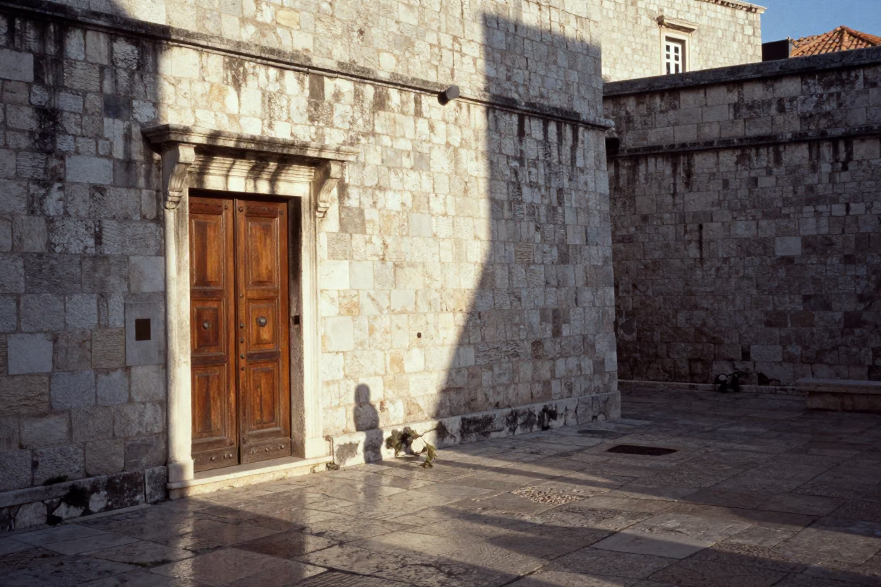 Dubrovnik Croatia Late Afternoon Sunlight on Ancient Stone Walls and Traditional Door Wreaths in in Dubrovnik, Croatia
