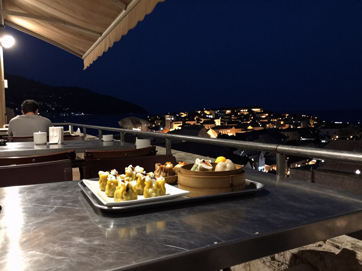 Dubrovnik Croatia Night Street Scene With Brushed Steel Tabletop And Dim Sum in in Dubrovnik, Croatia