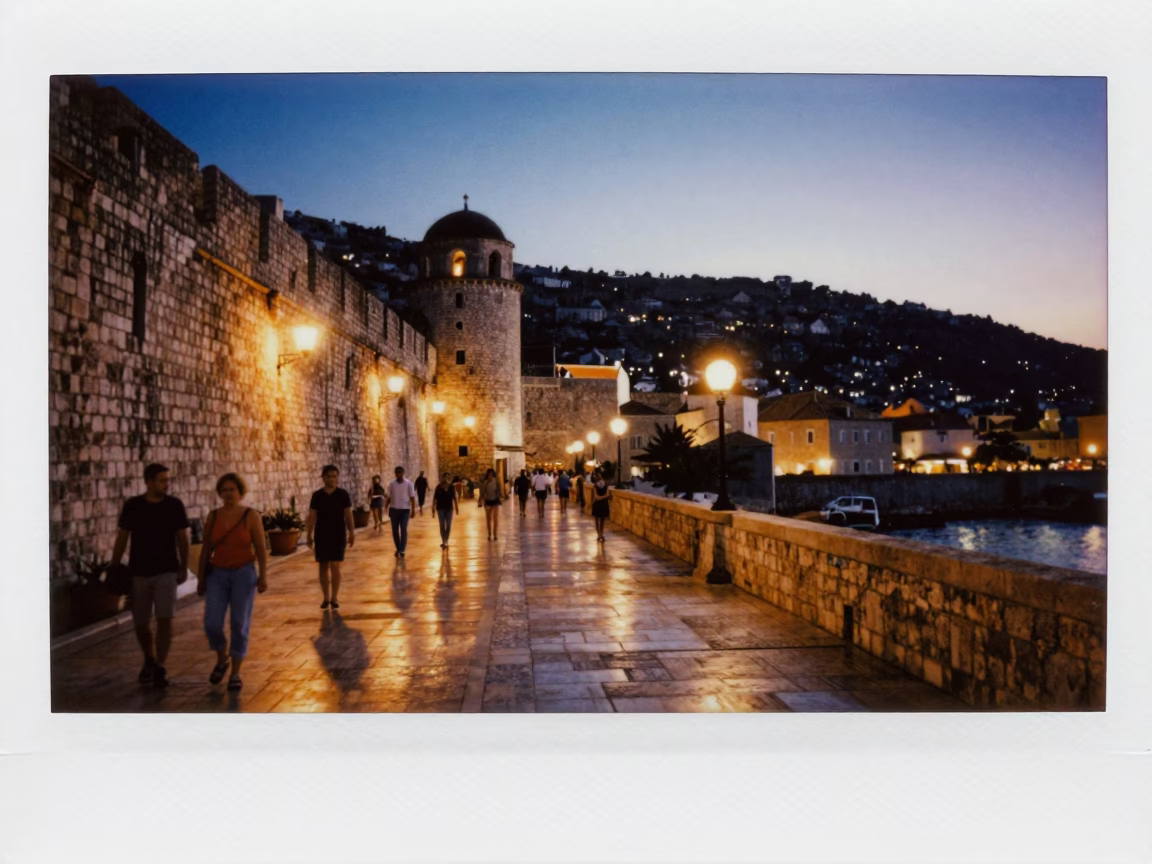 Dubrovnik Evening Lights Glow Over Old Town Stone Walls and Local Street Scene in in Dubrovnik, Croatia