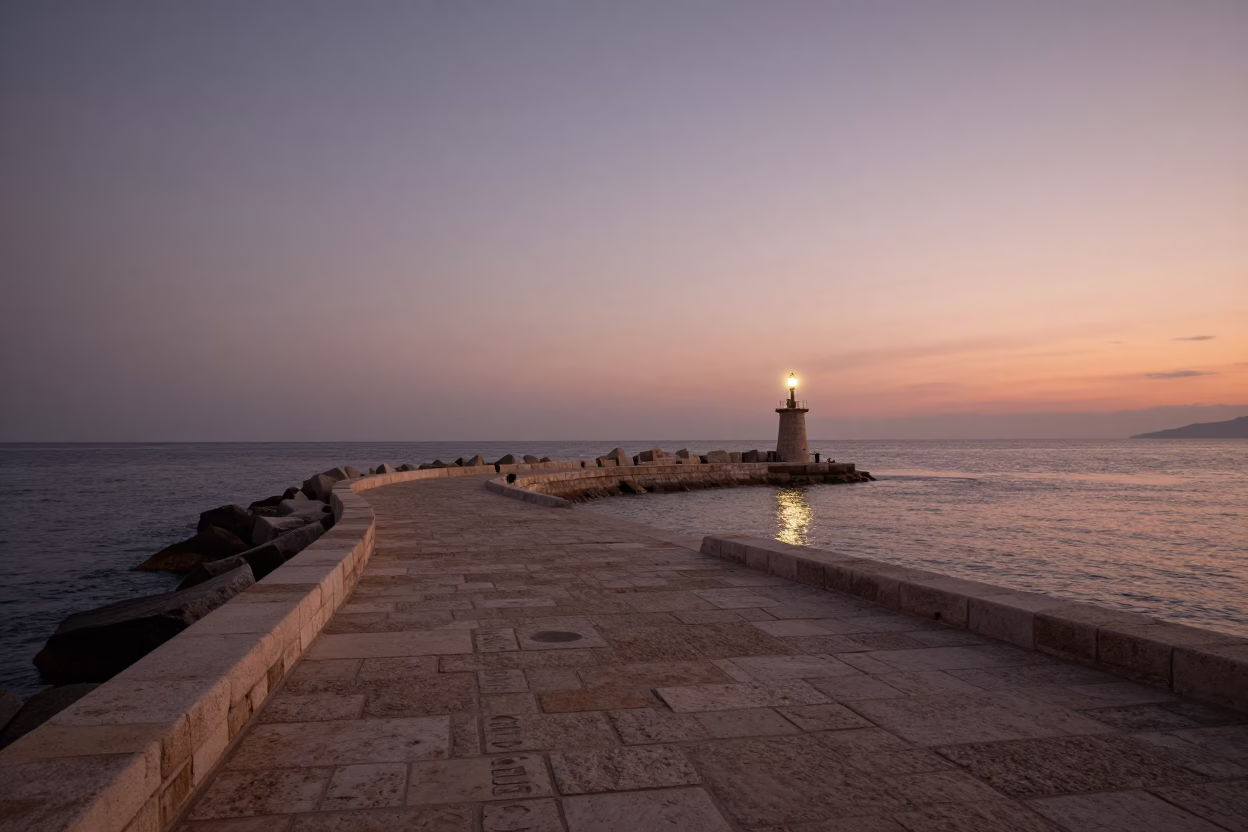 Dubrovnik Harbor Breakwater Beacon in Copper Dusk Light with Fisherman and Crate in in Dubrovnik, Croatia