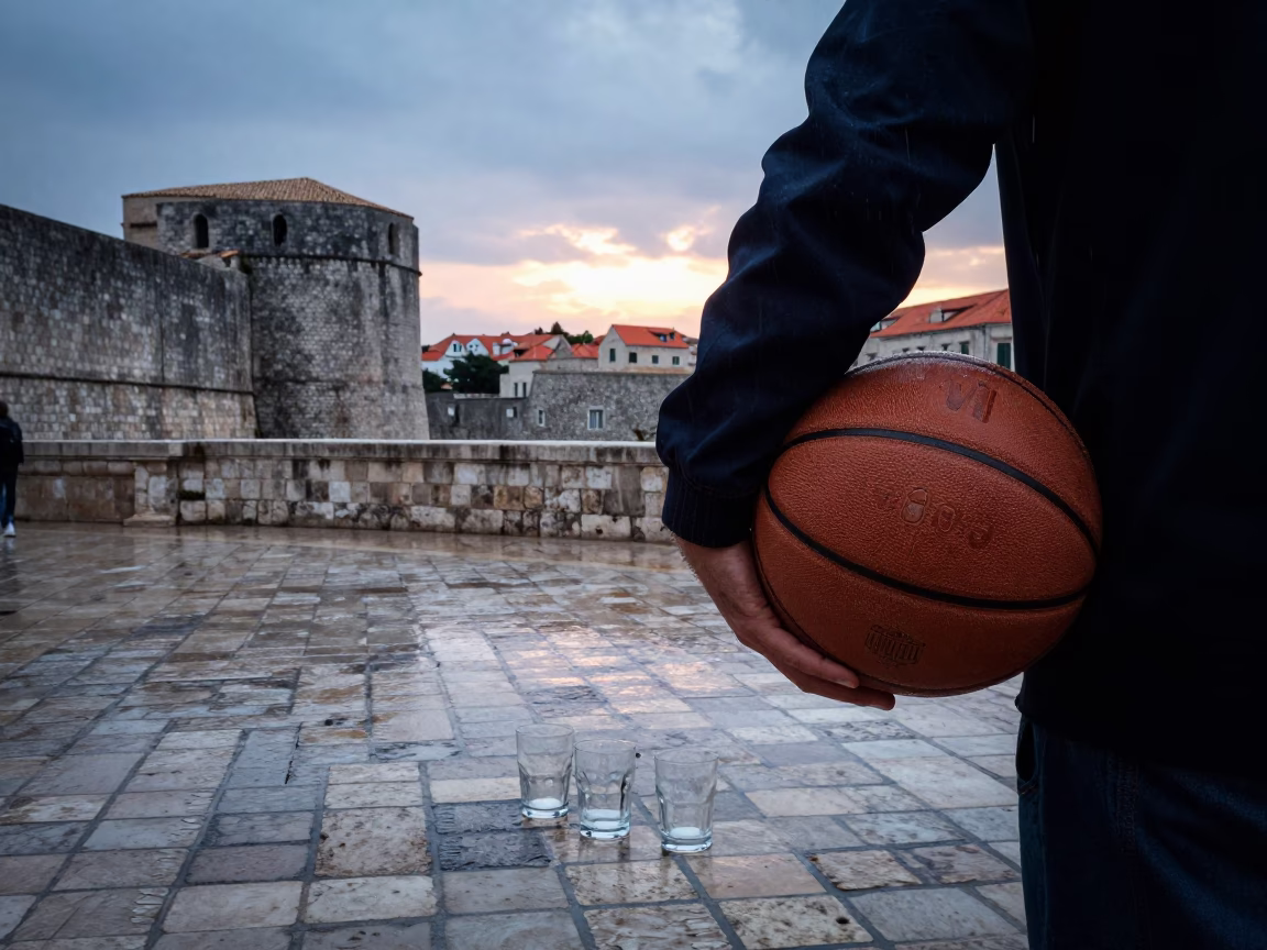 Dubrovnik light rain at dusk with leather basketball and glass tumblers in in Dubrovnik, Croatia