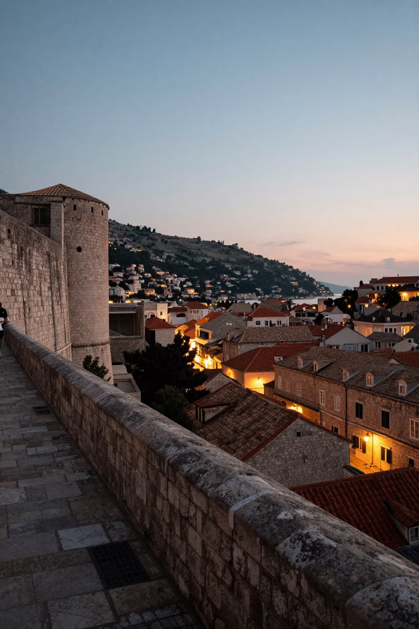 Dubrovnik Old Town evening view with limestone walls and glowing city lights in in Dubrovnik, Croatia