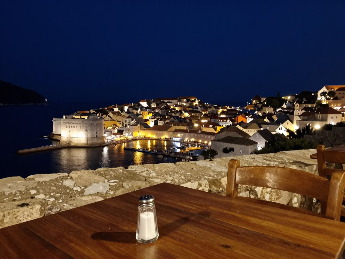 Dubrovnik Old Town Night View with Salt Shaker and Lamp Illuminating Stone Table in in Dubrovnik, Croatia