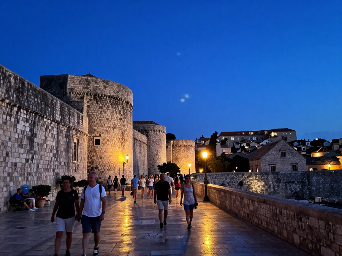 Dubrovnik Old Town twilight scene with tourists and historic stone walls in in Dubrovnik, Croatia