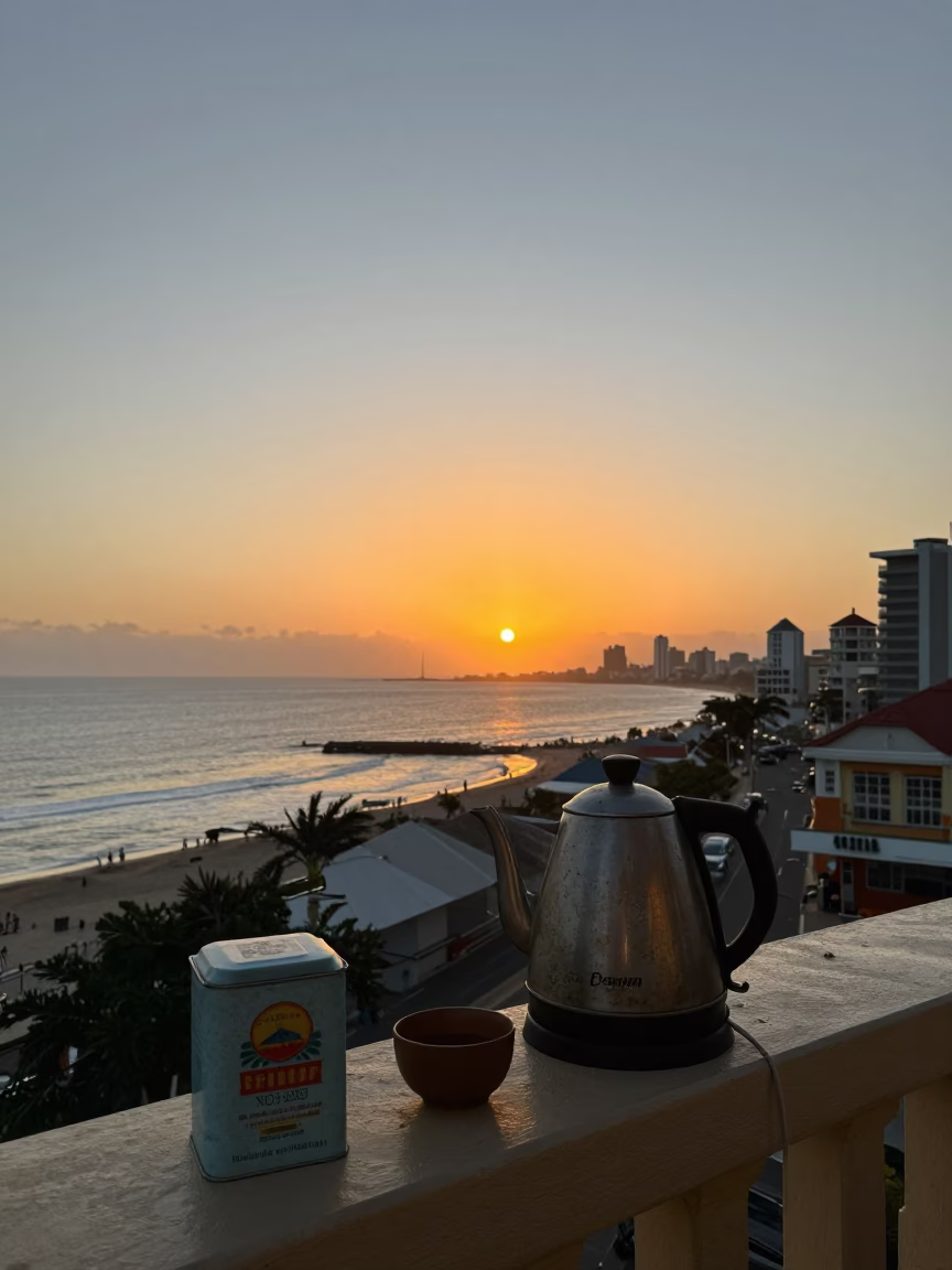 Durban Sunset Street Scene with Electric Kettle and Tea Tin on Balcony in in Durban, South Africa