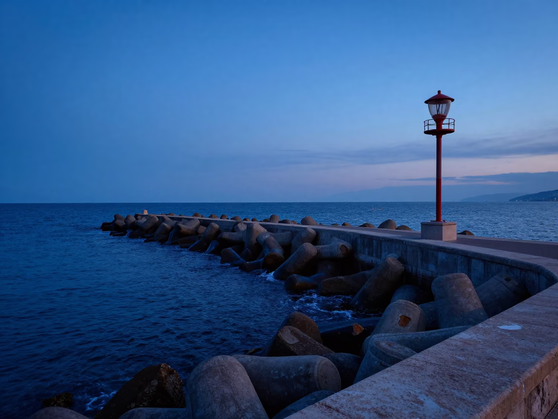 Dusk in Nice France Coastal Breakwater and Warning Beacons at Twilight in in Nice, France