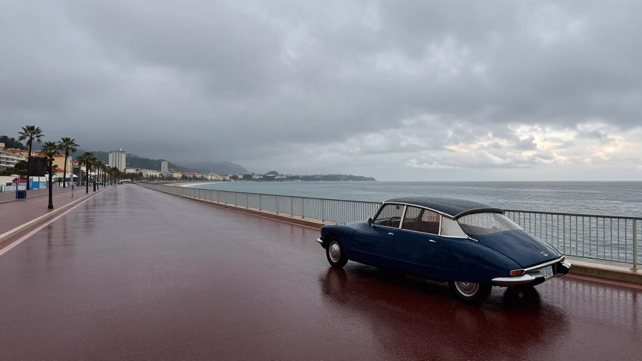 Dusk Rain on Promenade des Anglais with Vintage Car and Umbrella in in Nice, France