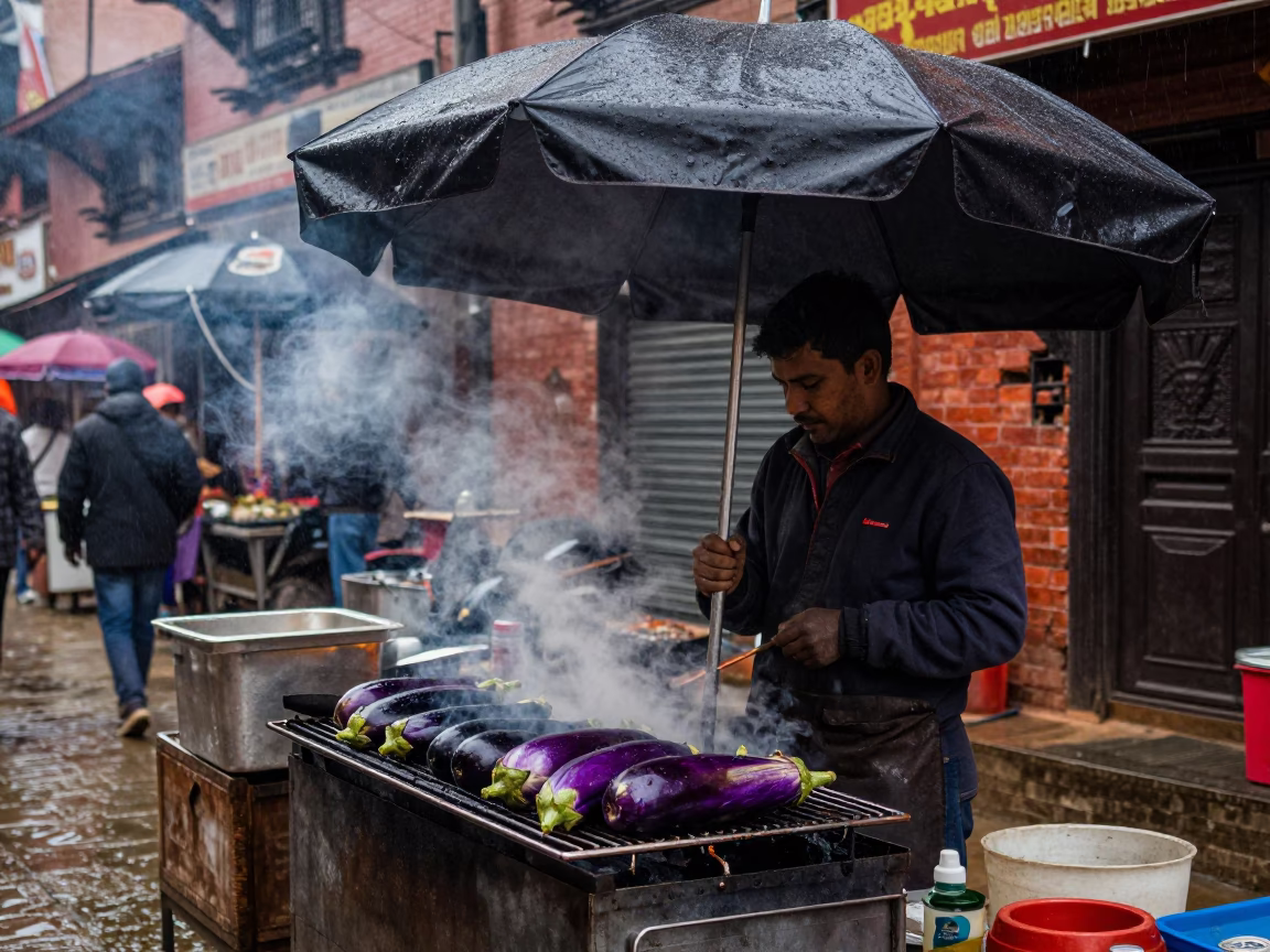 Dusk street vendor in Kathmandu cooking eggplants under wet umbrella in in Kathmandu, Nepal