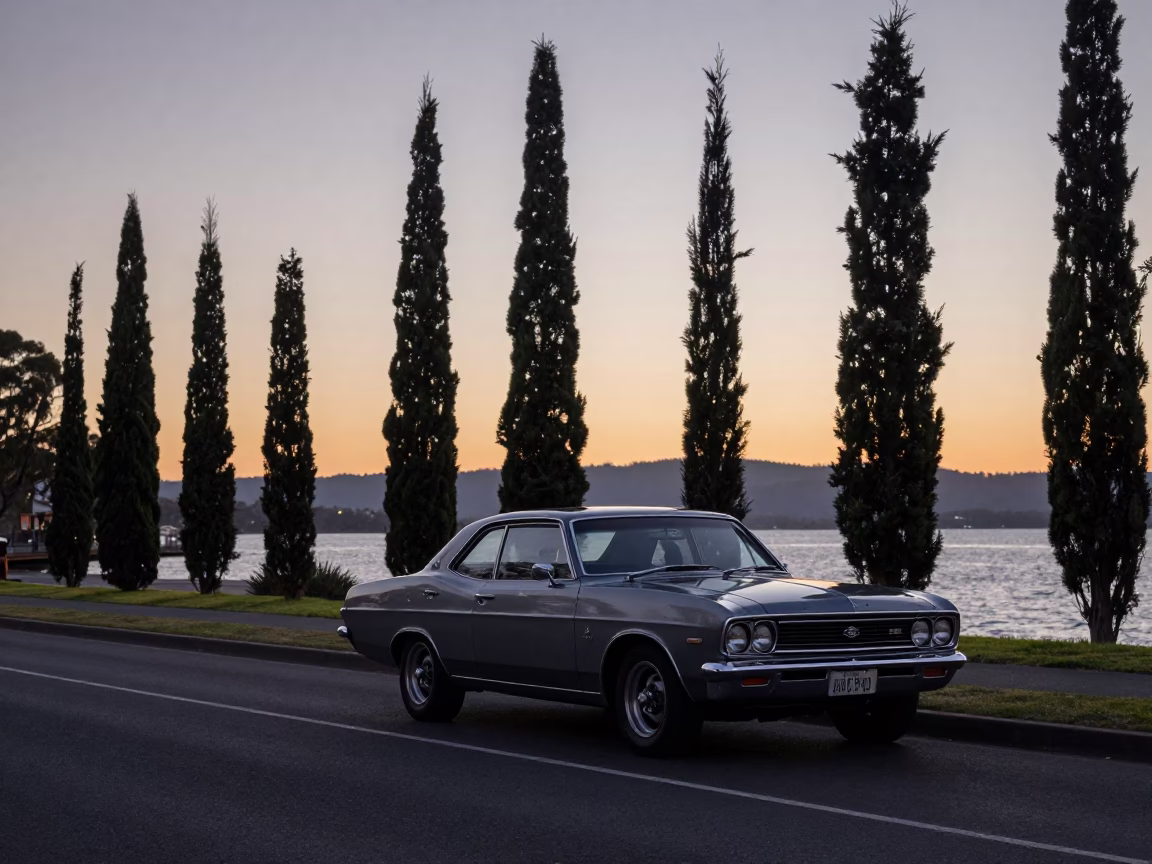 Early Dawn Hobart Street Scene with Vintage 1970s Car and Cypress Trees in in Hobart, Tasmania, Australia