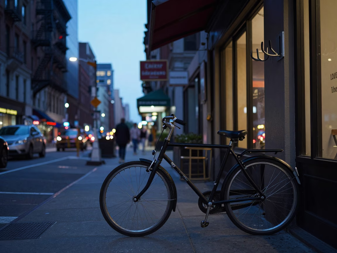 Early Evening New York Street Scene with Bicycle Leaning Against Cafe Exterior in in New York, New York, United States