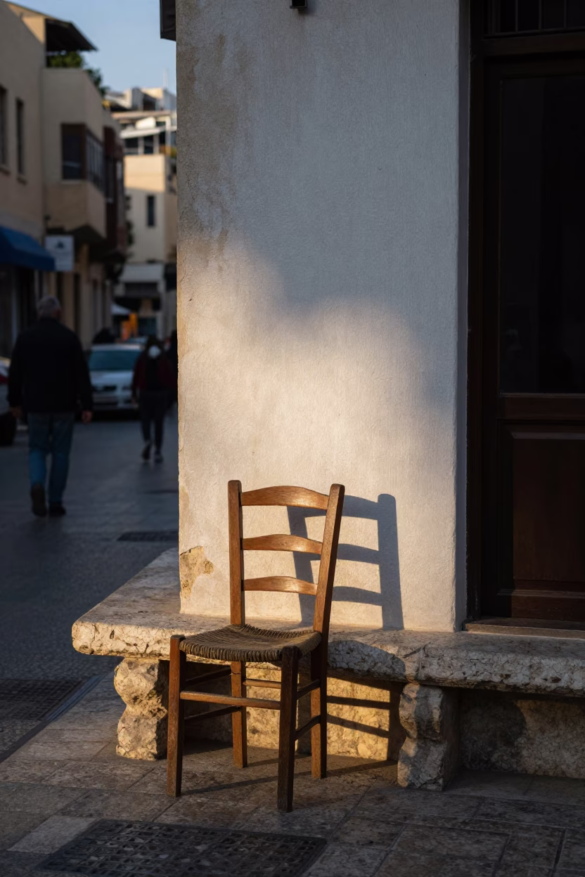 Early Evening Street Scene in Beirut Lebanon with Stone Bench and Ladder-Back Chair in in Beirut, Lebanon