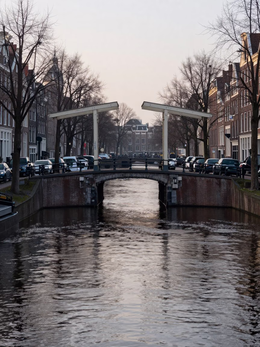 Early Morning Amsterdam Canal Scene with Drawbridge and Swollen River Water in in Amsterdam, Netherlands
