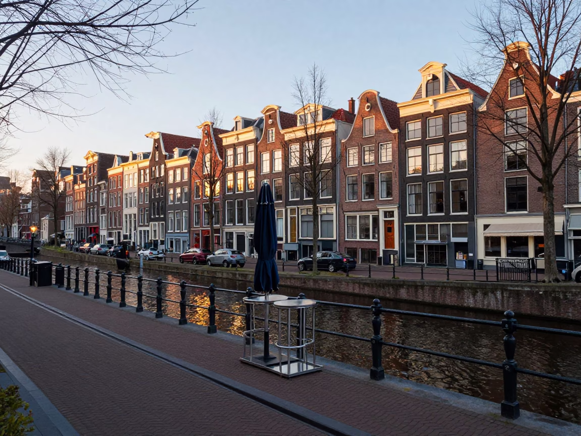 Early Morning Amsterdam Canal Street Scene with Umbrella Stand and Brick Architecture in in Amsterdam, Netherlands