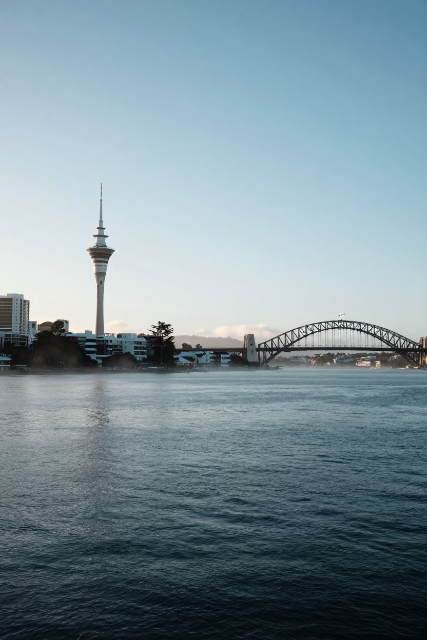 Early Morning Auckland Sky Tower and Harbor Bridge from Viaduct Harbour Waterside Walkway in in Auckland, New Zealand