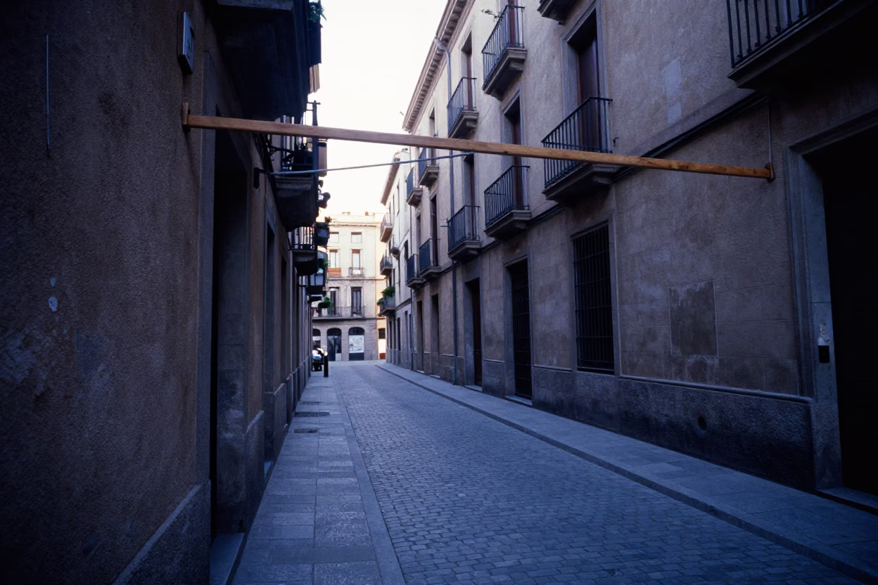 Early Morning Barcelona Street Scene with Wooden Hanger and Fallen Petals Before Sunrise in in Barcelona, Spain