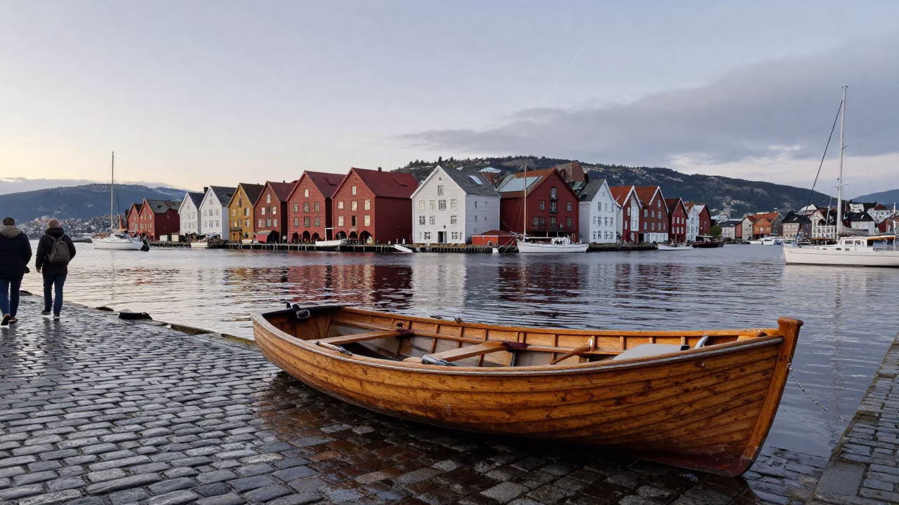 Early Morning Bergen Norway Harbor Scene with Wooden Rowboat and Coiled Rope on Cobblestones in in Bergen, Norway