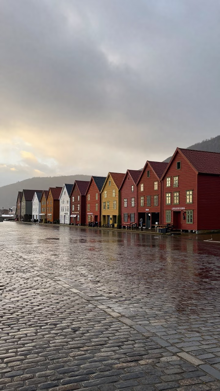 Early Morning Bergen Norway Rain Wet Cobblestones and Colorful Bryggen Wharf Buildings in in Bergen, Norway