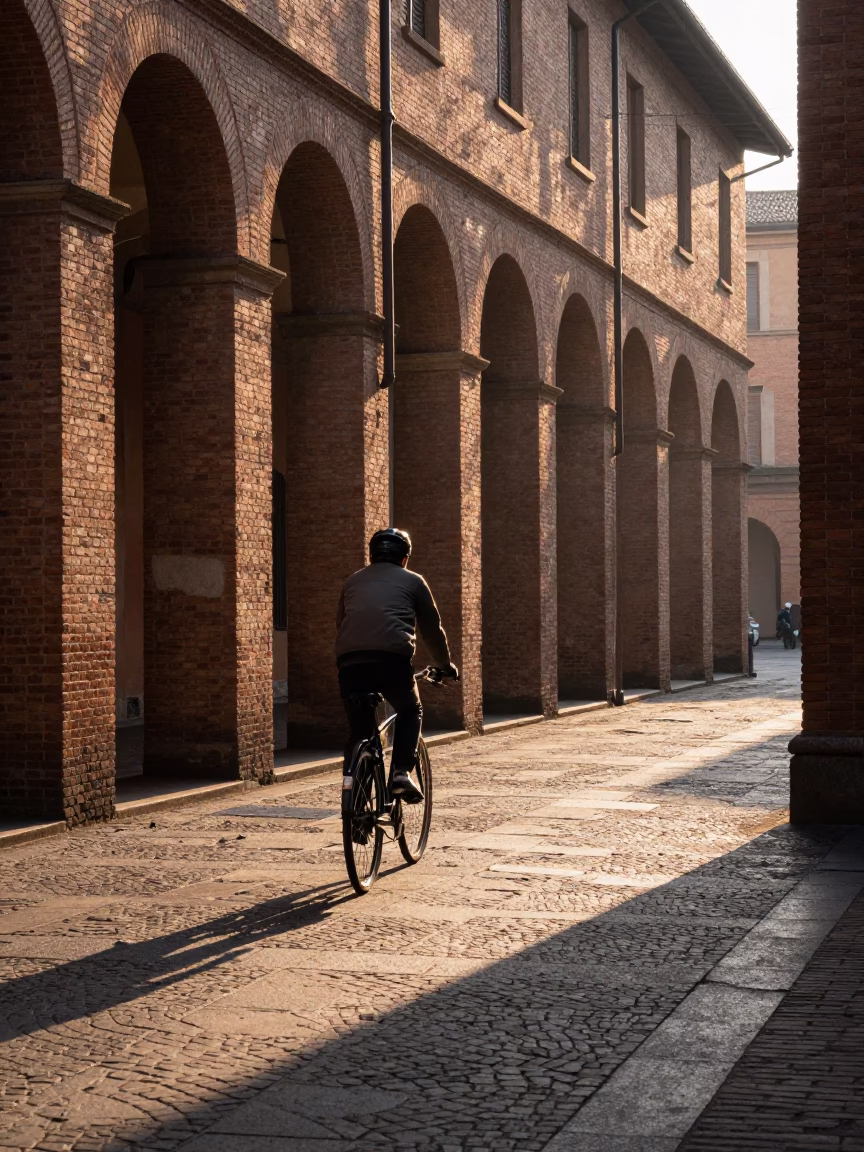 Early Morning Bicycle Ride Past Porticoes in Bologna Italy at Dawn in in Bologna, Italy