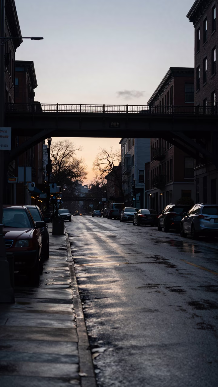 Early Morning Boston Street Scene with Viaduct Shadow and Rain Wet Pavement Before Sunrise in in Boston, Massachusetts, United States
