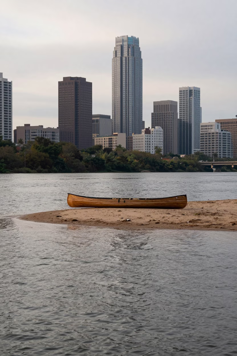 Early Morning Canoe Beached on Sandy River Island Near Austin Texas Downtown Skyline in in Austin, Texas, United States