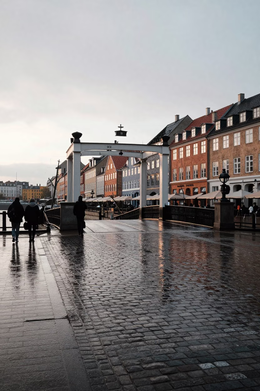 Early Morning Copenhagen Street Scene with Rain-Slicked Cobblestones and Drawbridge in in Copenhagen, Denmark