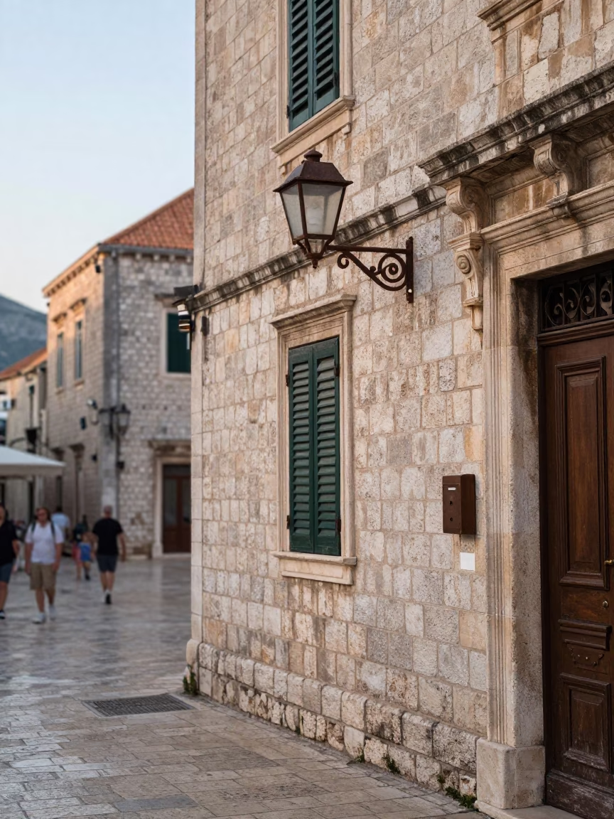 Early Morning Dubrovnik Croatia Street Scene with Wall Sconce and Local Life in in Dubrovnik, Croatia