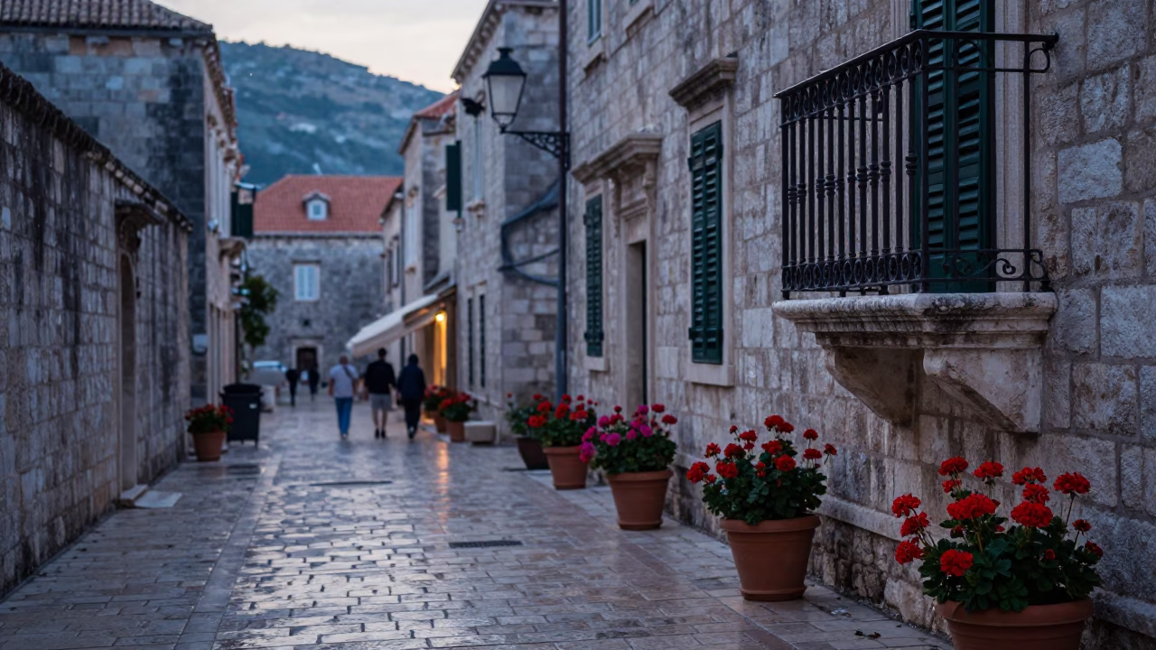 Early Morning Dubrovnik Street Scene with Potted Geraniums and Morning Mist in in Dubrovnik, Croatia