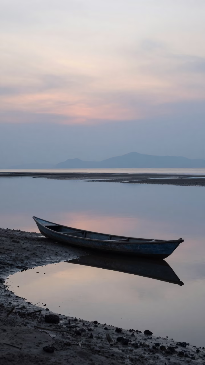 Early Morning Fishing Scene in Phuket Thailand with Canoe Reflections in in Phuket, Thailand