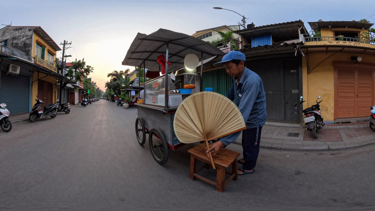Early Morning Hanoi Street Scene with Folding Fan and Work Stool in in Hanoi, Vietnam
