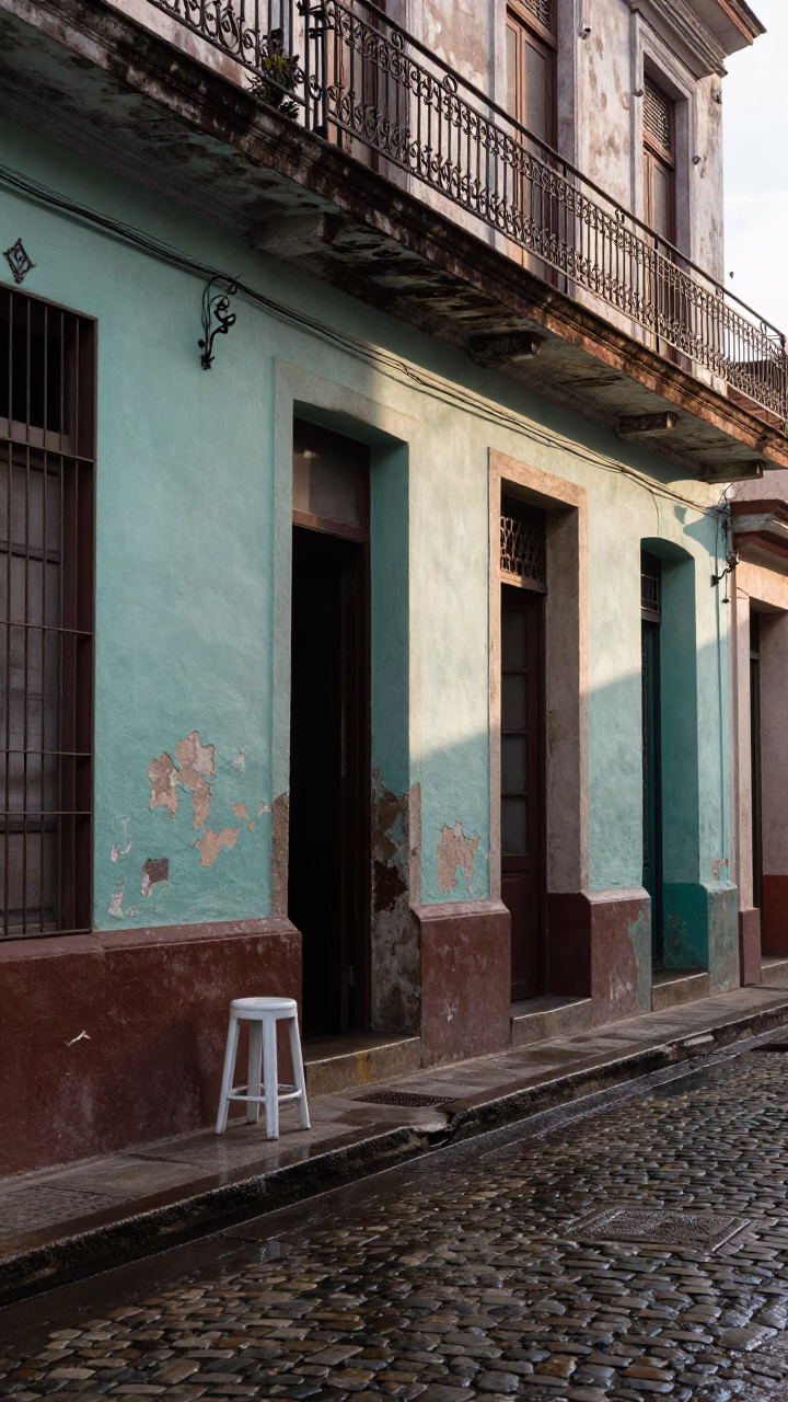Early Morning Havana Street Scene with Kitchen Stool and Brushed Steel Drain in in Havana, Cuba