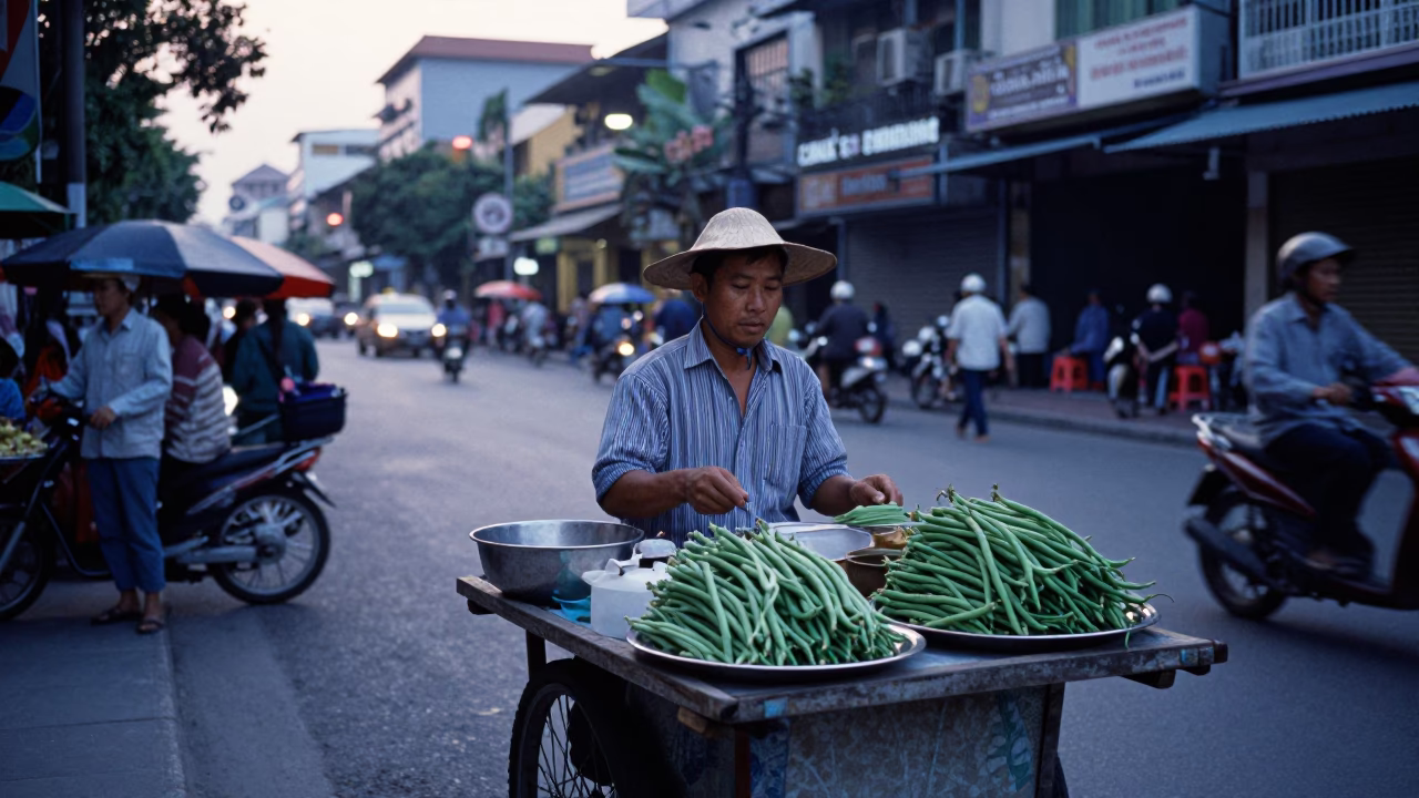 Early Morning Ho Chi Minh City Street Vendor Selling String Beans Before Sunrise in in Ho Chi Minh City, Vietnam
