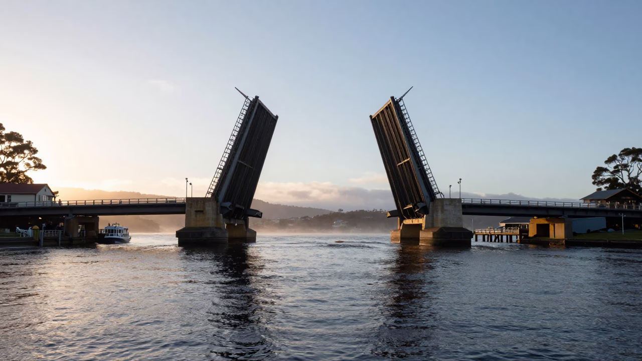 Early Morning Hobart Tasmania Drawbridge Rising Over Dark Tidal Channel Water in in Hobart, Tasmania, Australia