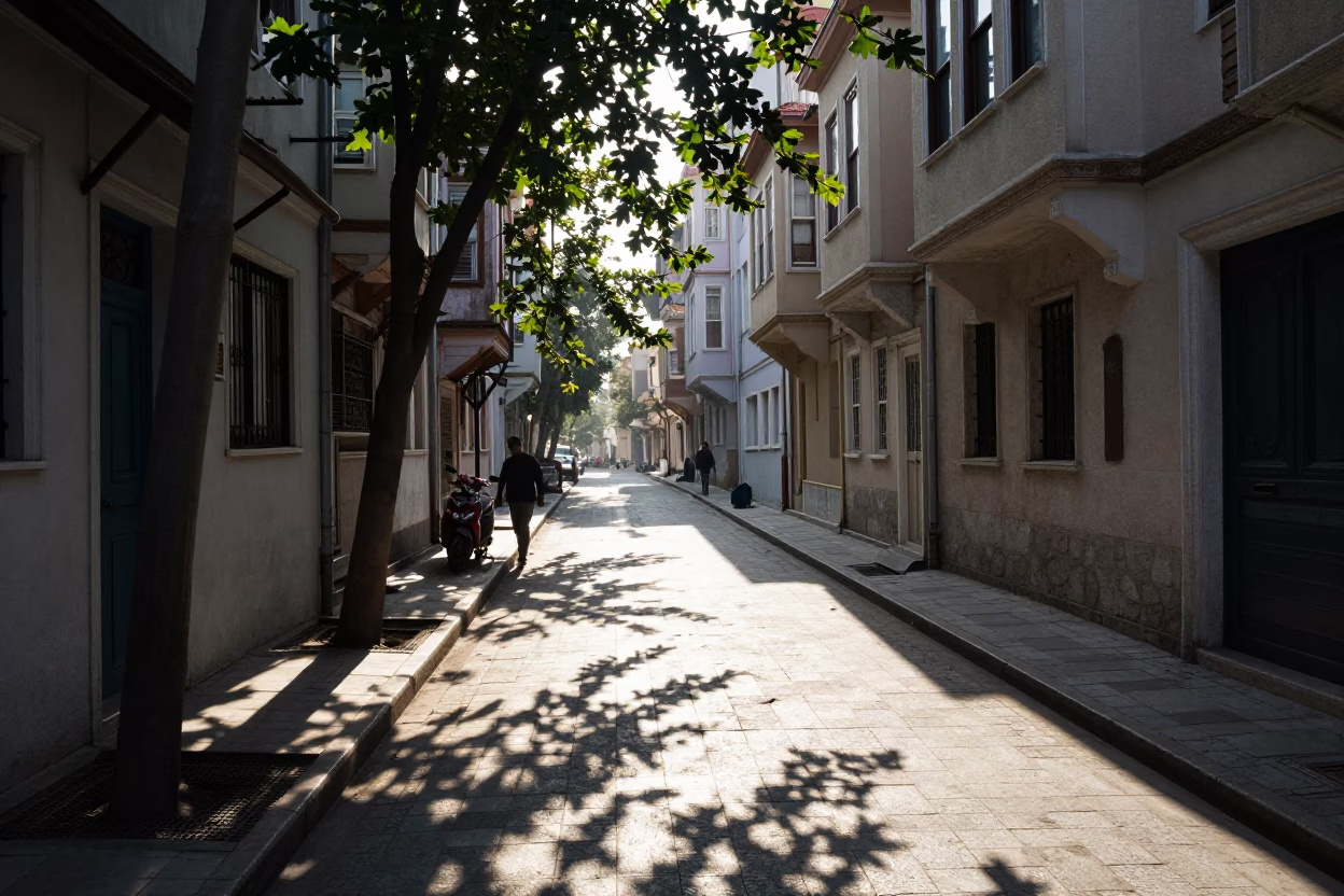 Early Morning Istanbul Street Scene with Leaf Shadows on Tile and Local Market Activity in in Istanbul, Turkey