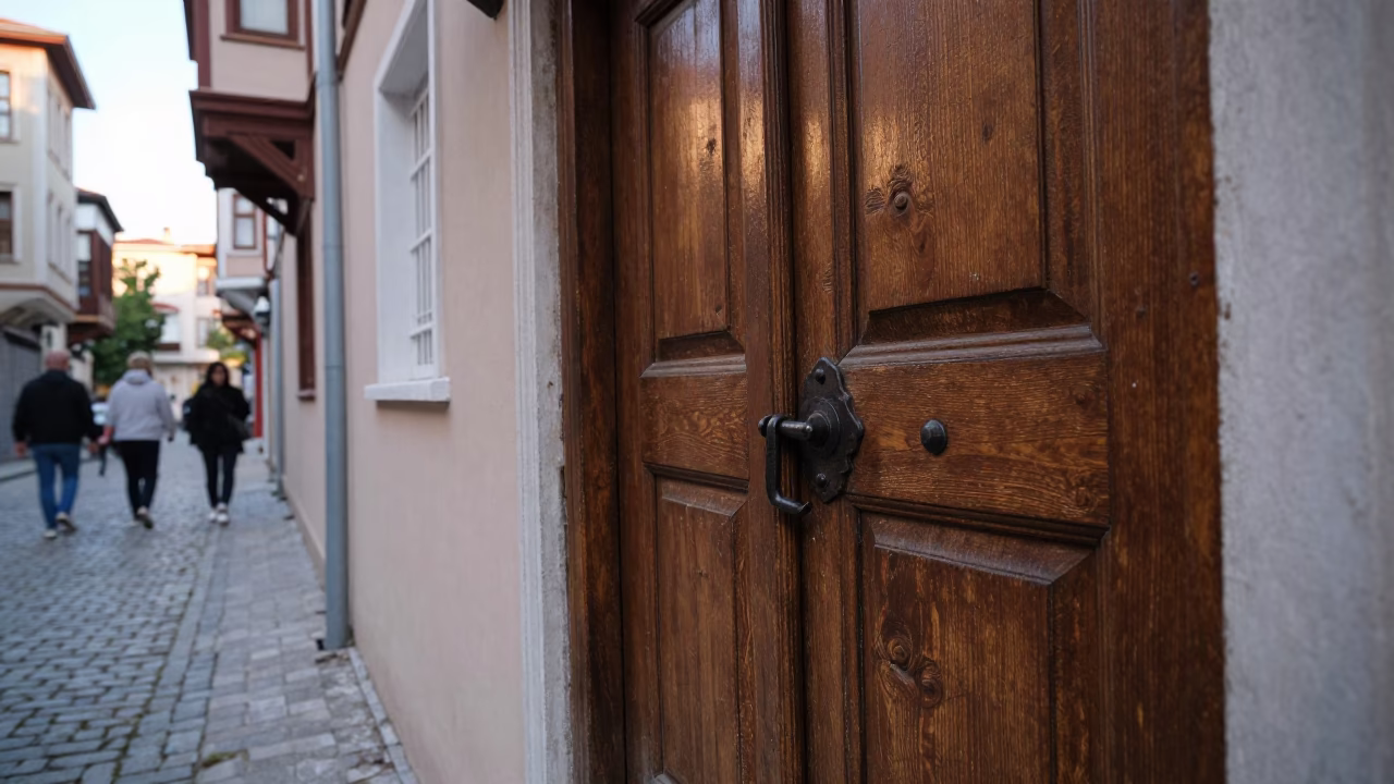 Early Morning Istanbul Street Scene with Wooden Door Iron Deadbolt and Churro Vendor in in Istanbul, Turkey