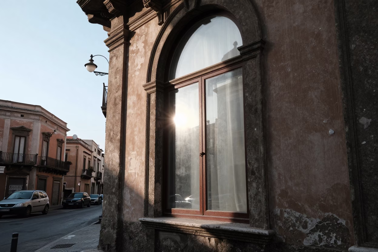 Early morning light in Palermo Italy street scene with window glass and fruit bowl in in Palermo, Italy