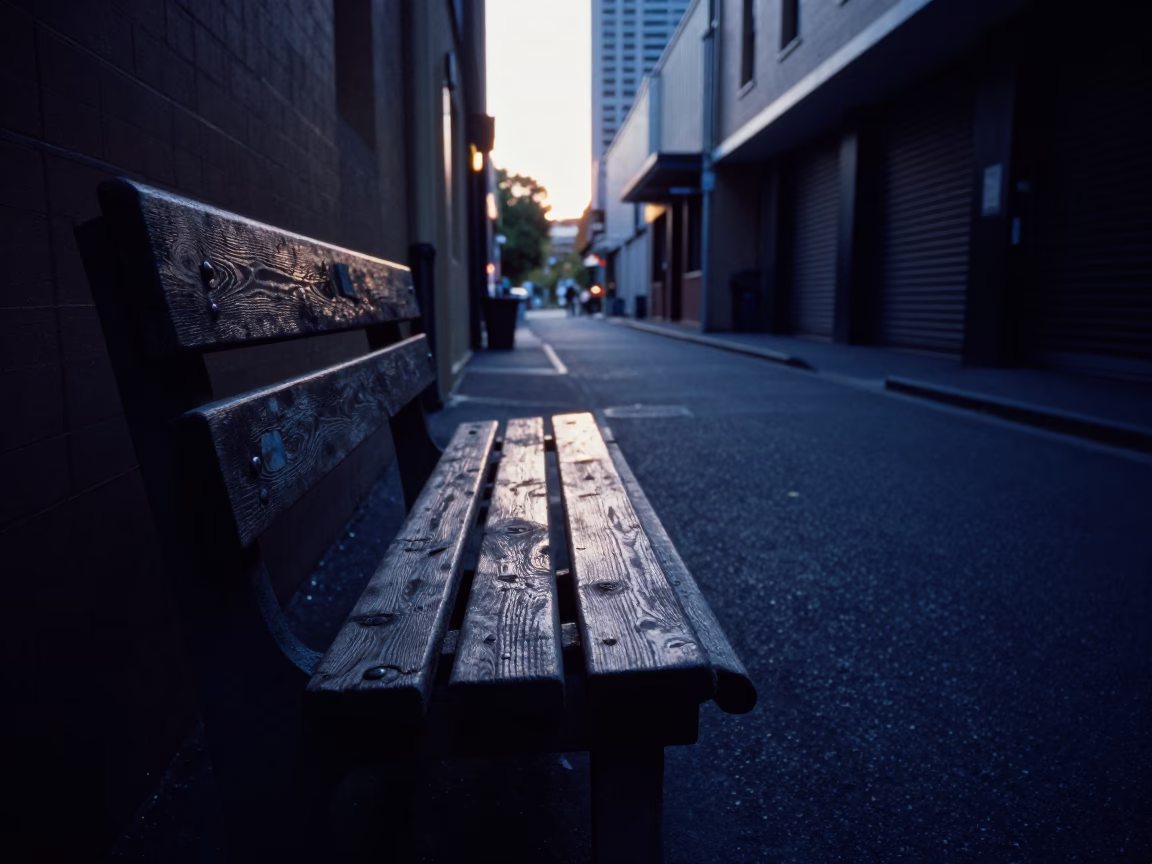 Early Morning Light on Weathered Timber Bench in Melbourne laneway before dawn in in Melbourne, Victoria, Australia