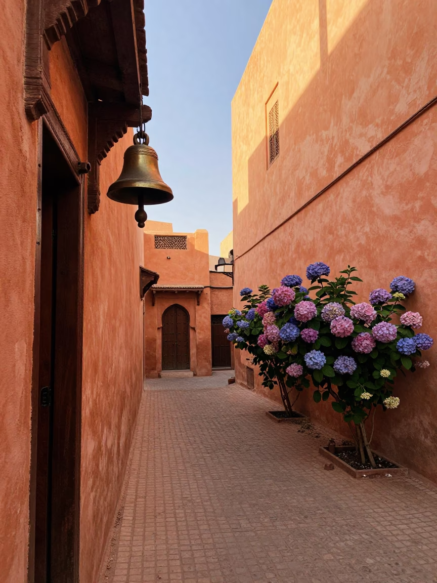 Early Morning Marrakech Medina Street with Bell and Hydrangea Bush in in Marrakech, Morocco