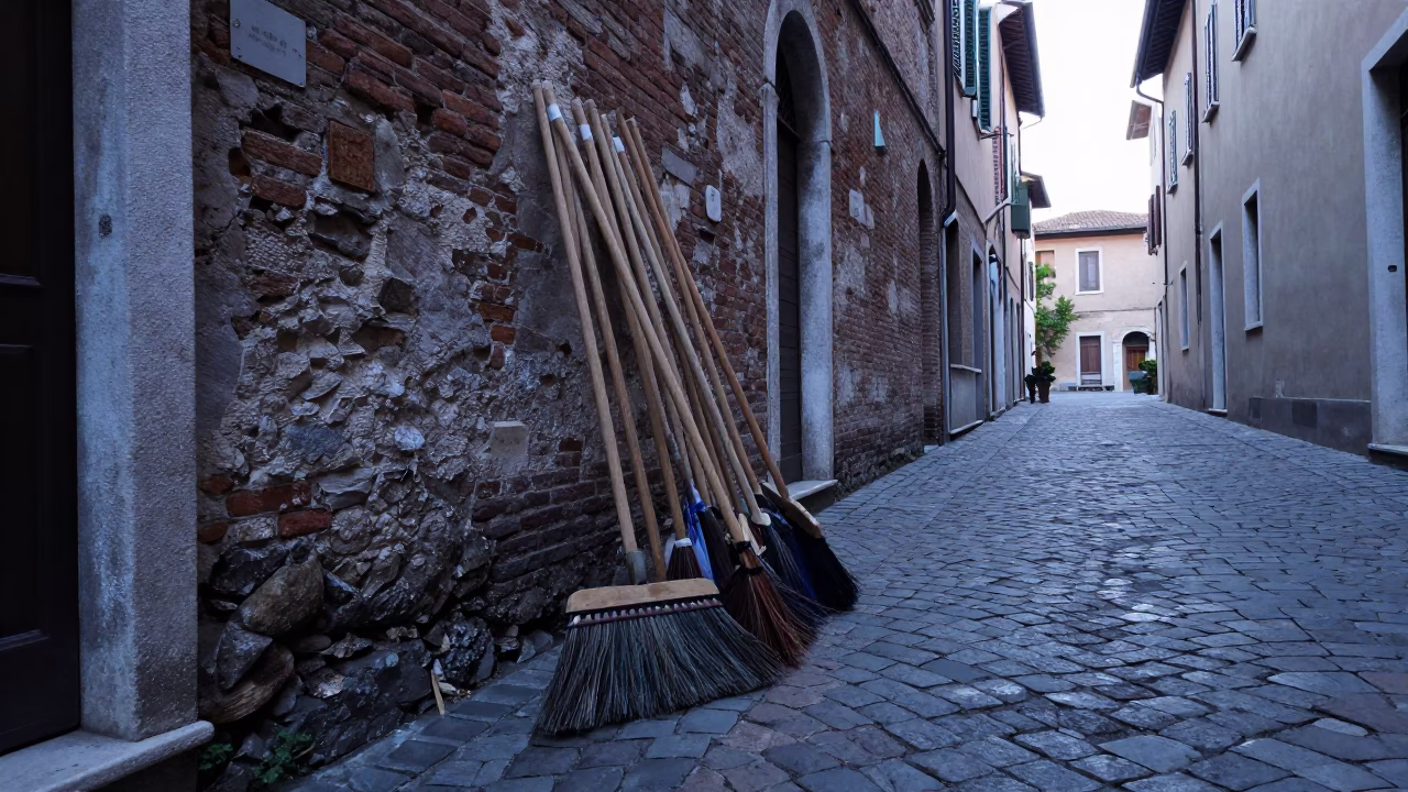 Early Morning Milan Alley with Brooms and Cobblestones in in Milan, Italy